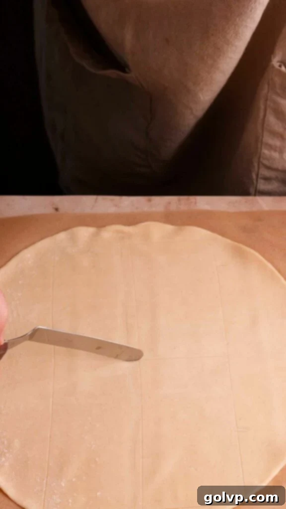 Lightly marking rectangles on the pie crust as a guide for filling placement.