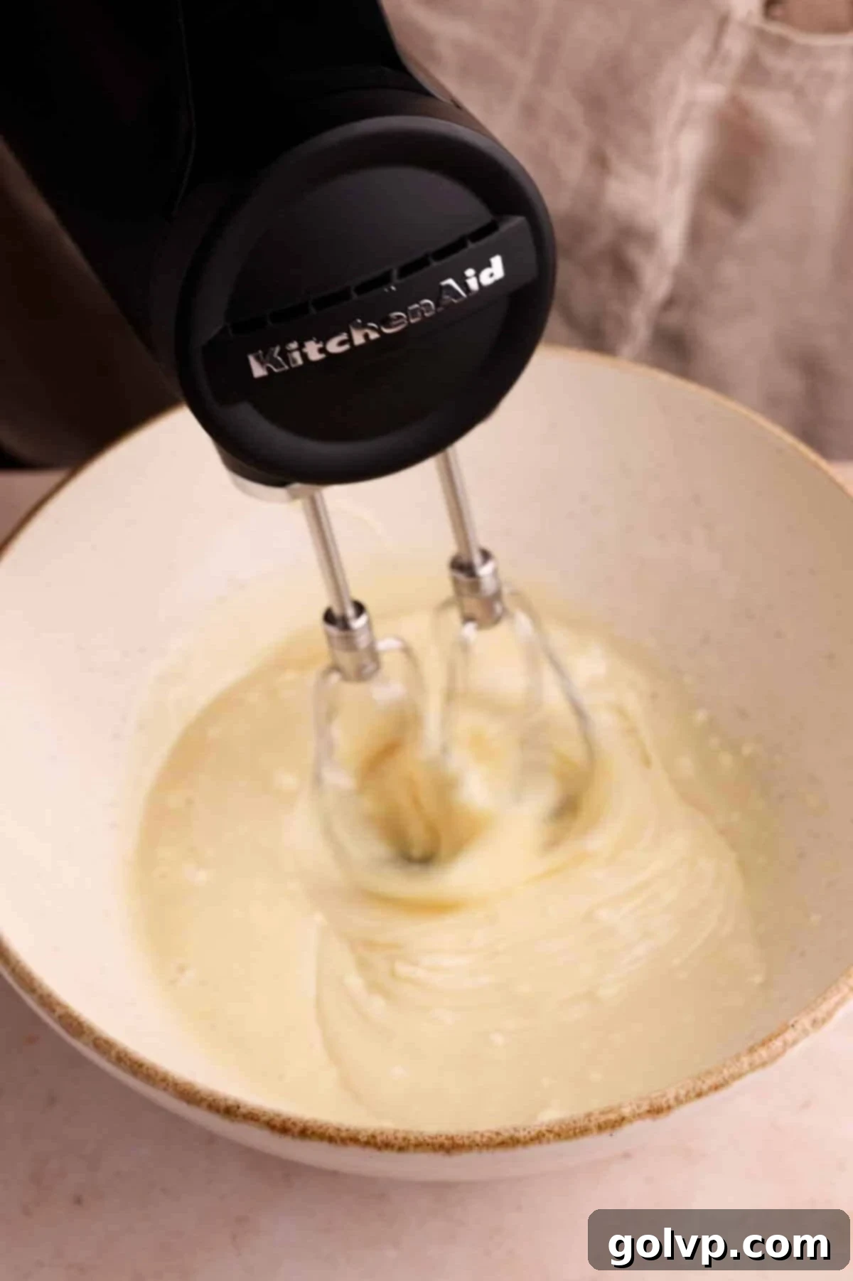 Spiced Carrot Cake Swirl 5 mixing cream cheese and condensed milk in a bowl