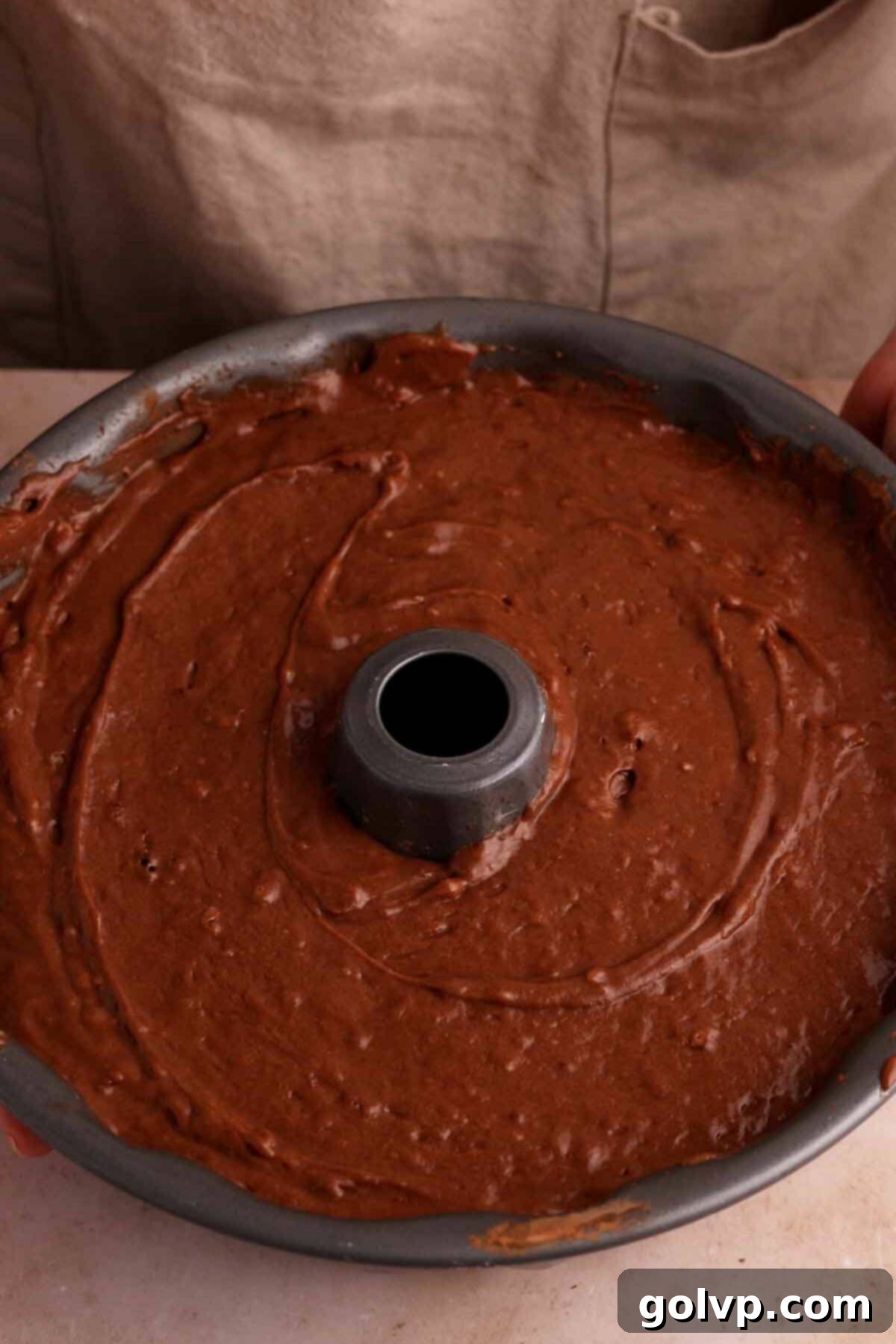 Chocolate bundt cake batter with creme eggs ready to bake.