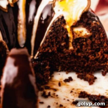 A beautiful slice of chocolate bundt cake, revealing a melted Cadbury creme egg center, perfectly glazed for Easter.