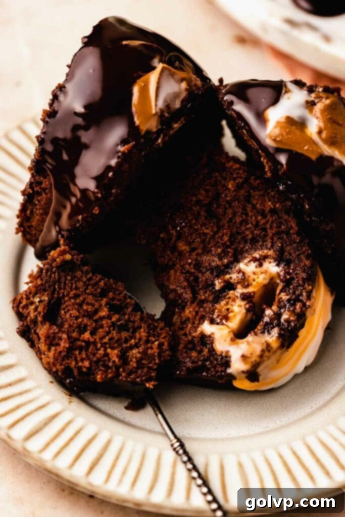 Person eating a slice of chocolate bundt cake with melted creme egg filling, perfect for an Easter party.