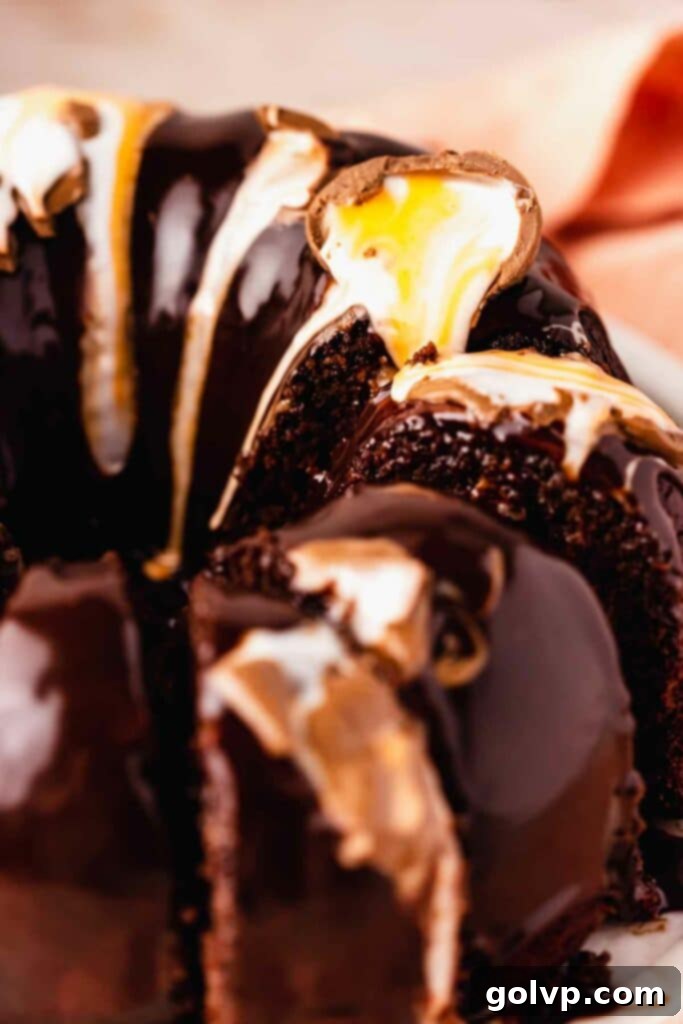 Beautifully decorated chocolate bundt cake with melted Cadbury creme eggs on top, ready for an Easter celebration.