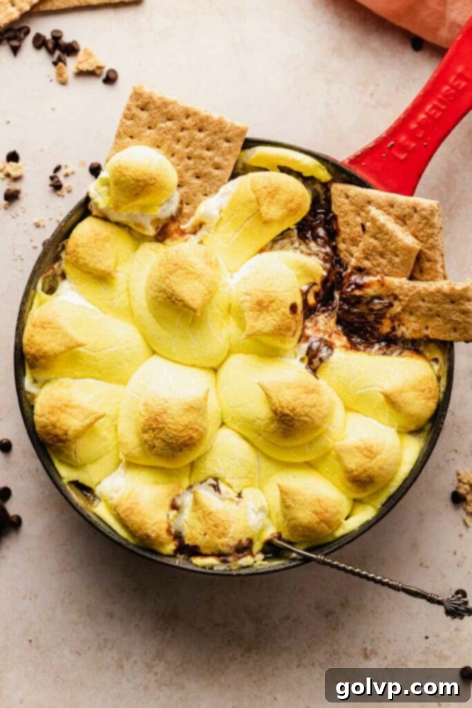 Skillet with melted chocolate, peeps, and graham crackers