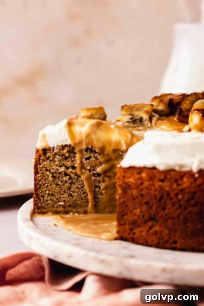 slicing a delectable banoffee cake to reveal its layers of banana, toffee, and cream