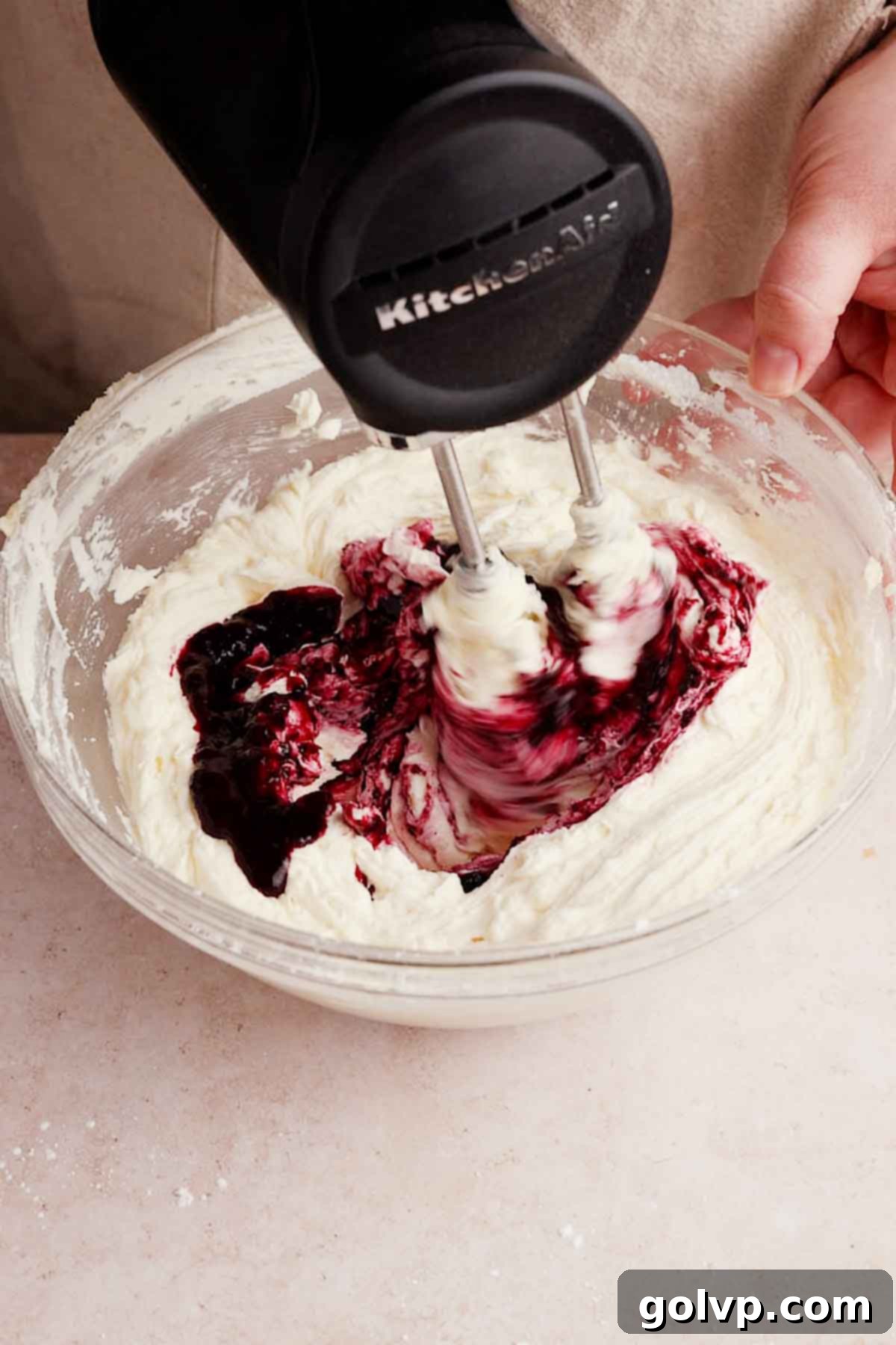 adding blueberry filling into frosting to make it purple