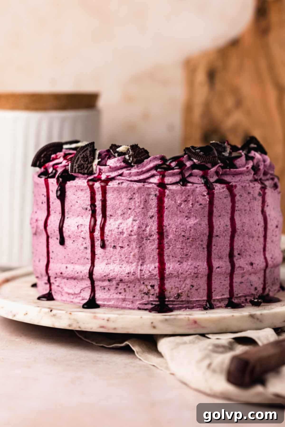 blue blueberry cake with blueberry drip and oreos