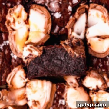Close-up of fudgy brownies topped with melted Cadbury Creme Eggs and a crinkly top
