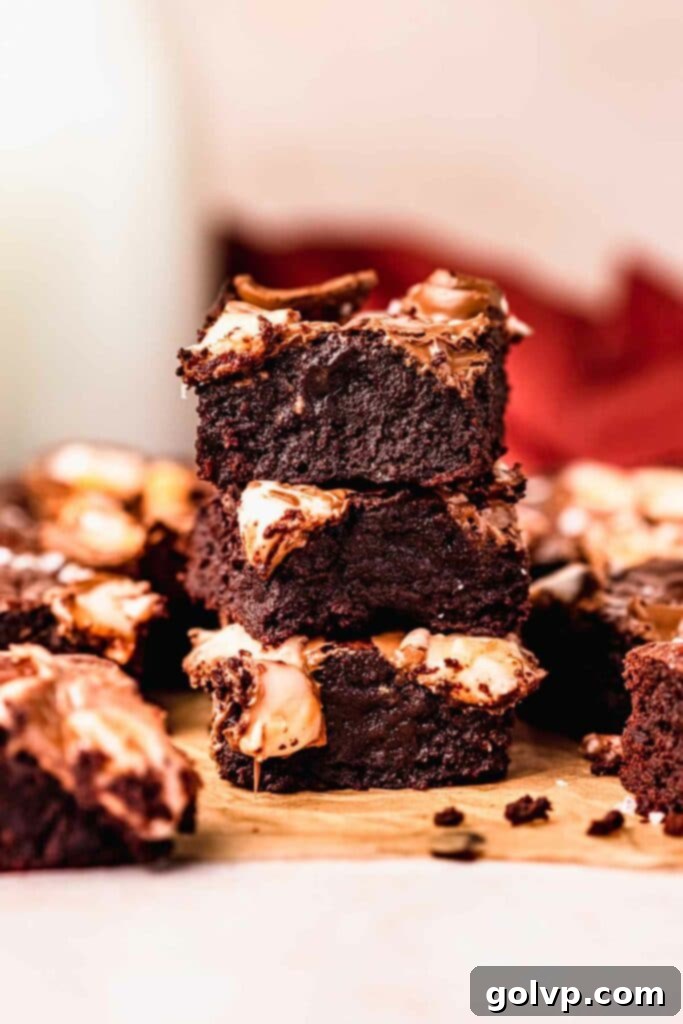 Freshly baked Creme Egg Brownies, showing their fudgy interior and melted creme egg topping