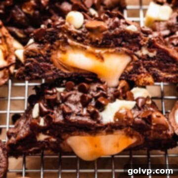 Cut open chocolate cookie with creme egg in middle