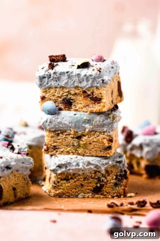 Speckled Egg Blondie Squares 2 stack of mini egg cookie bars with cream cheese frosting, perfect for Easter dessert