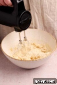 beating wet ingredients for mini egg bars
