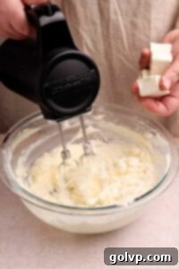 adding cream cheese to frosting