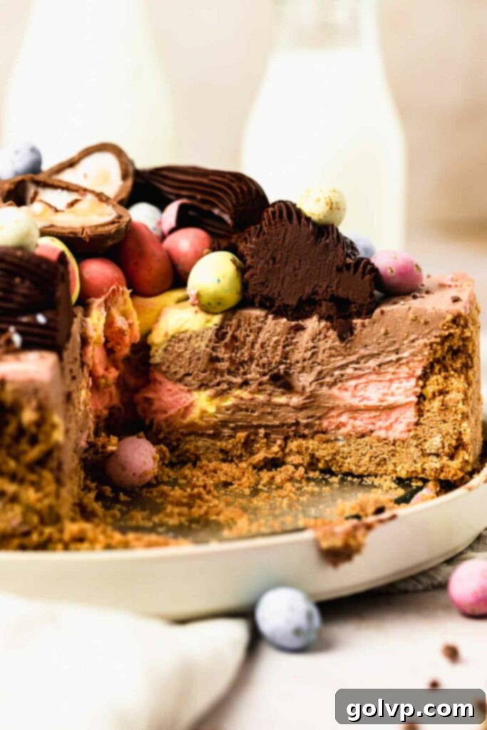 Slice of mini egg cheesecake with chocolate, pink, and yellow swirls