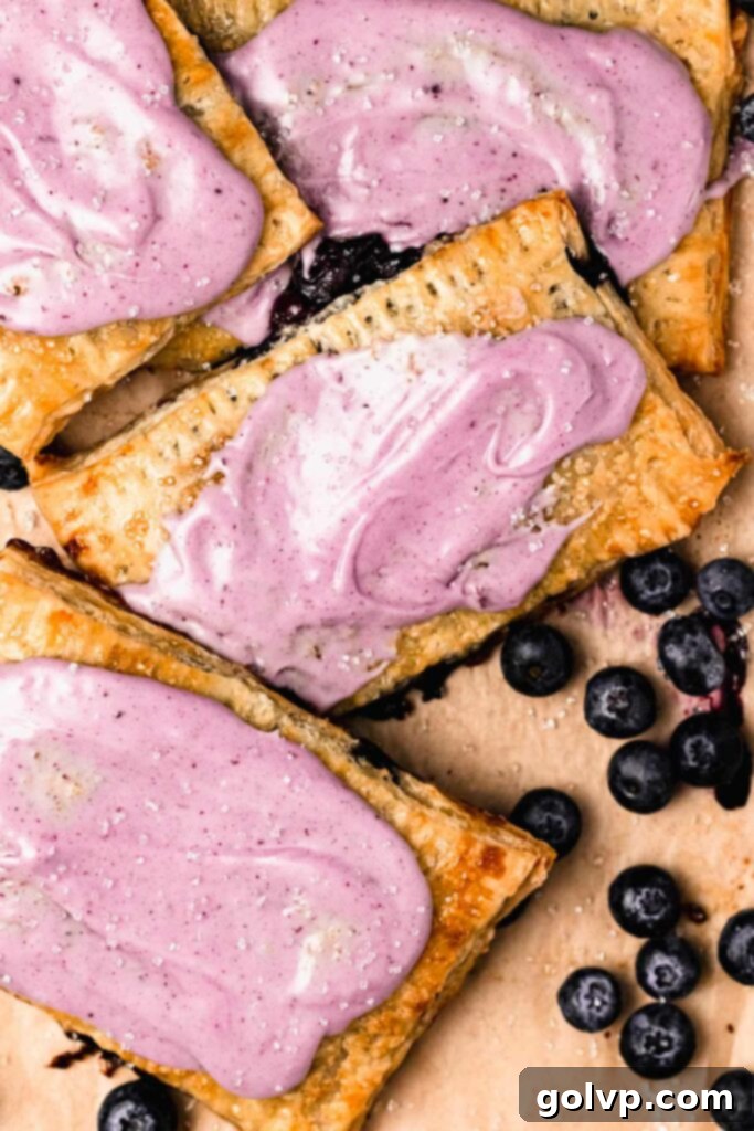 Blueberry pop tarts with purple blueberry glaze, ready to be enjoyed