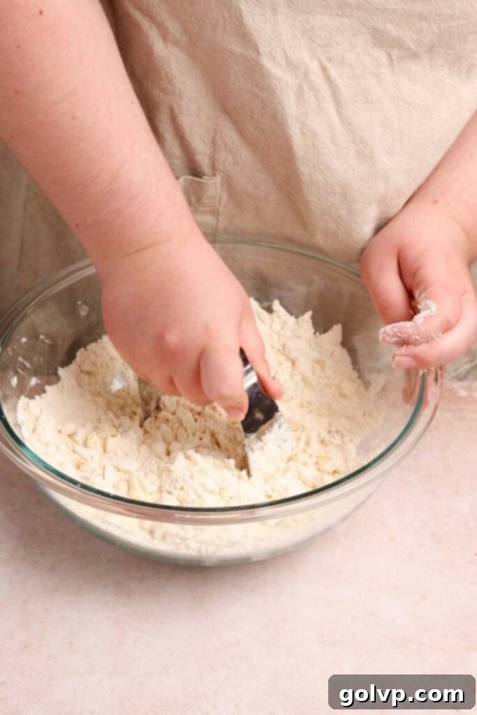 Cutting cold butter into flour mixture for a flaky pop tart crust