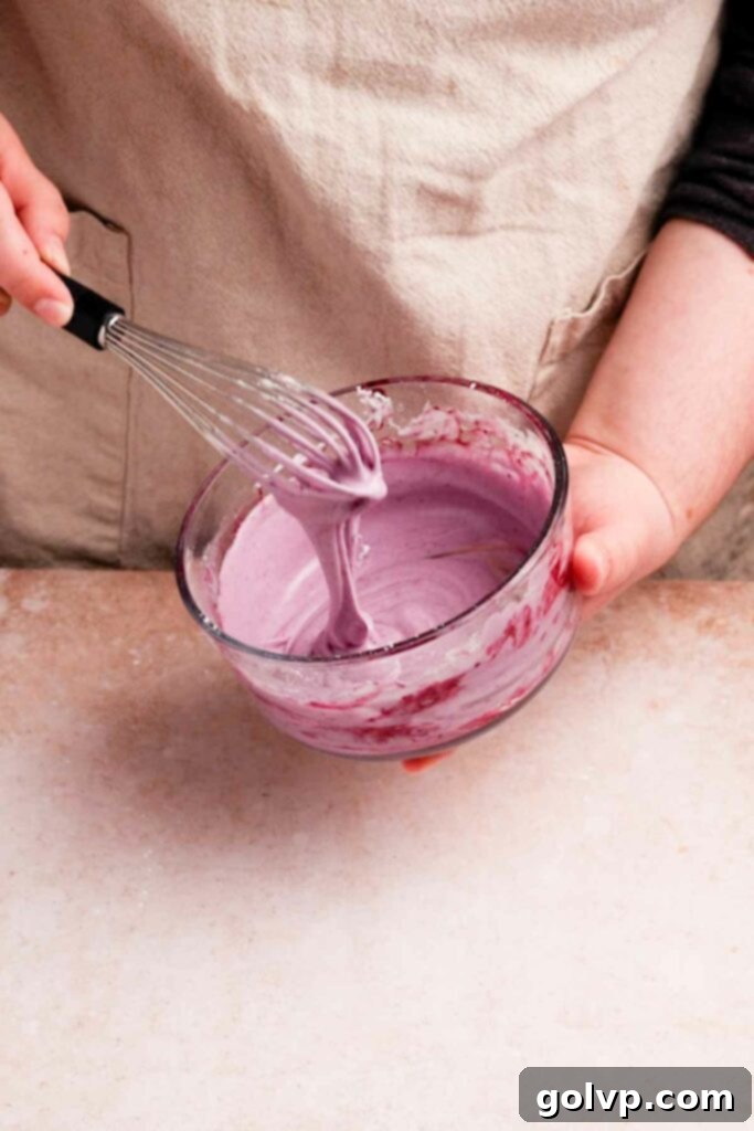 Whisking blueberry glaze until smooth and creamy for pop tarts
