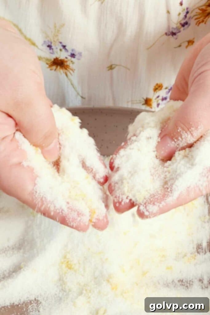 rubbing zest into sugar for lemon butter cake
