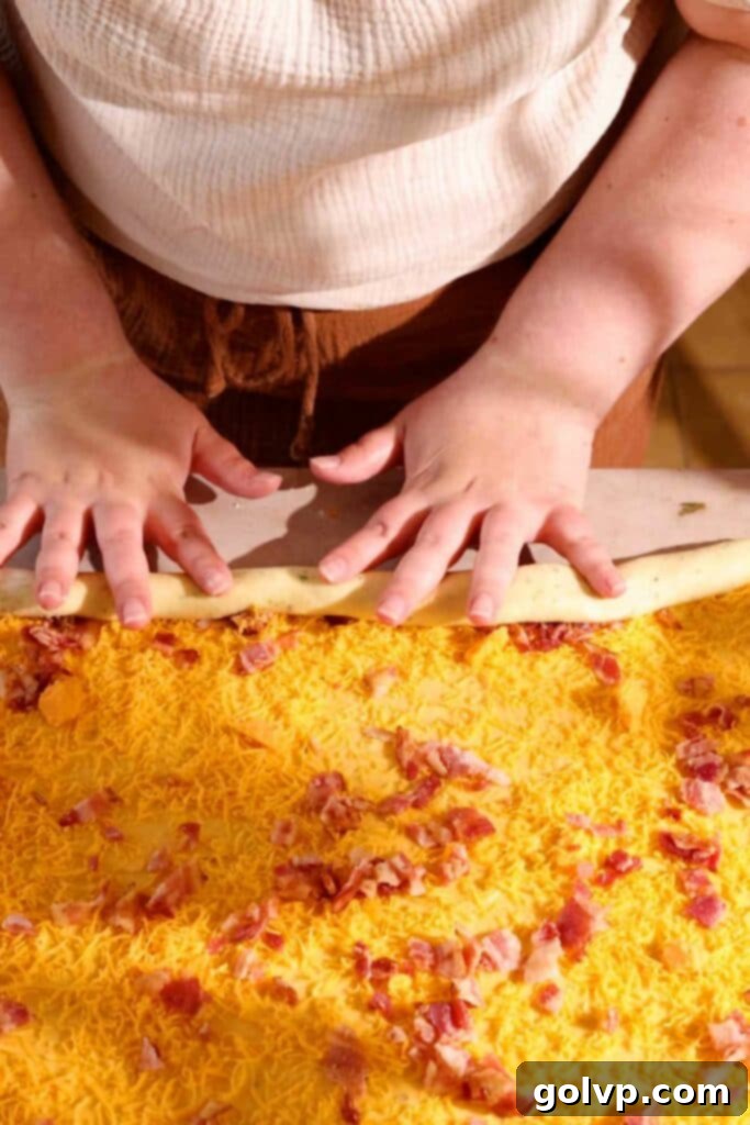 rolling up cheese and bacon rolls