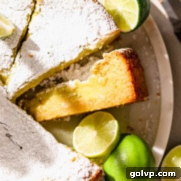 Sliced lime butter cake inside, showing the gooey texture and vibrant filling.