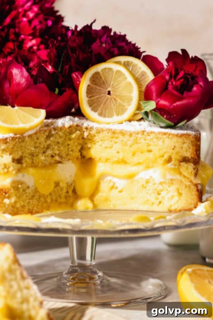 Zesty Lemon Victoria Sponge 3 Victoria sponge filled with lemon curd and topped with fresh flowers.