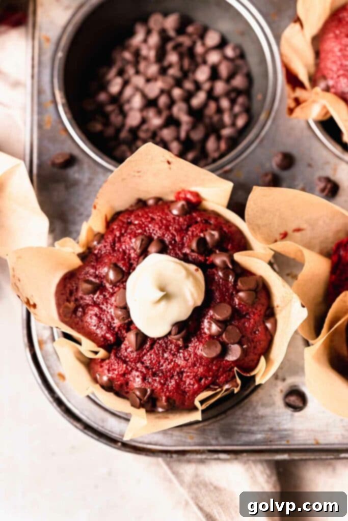 Red velvet muffin with dollop of cream cheese filling