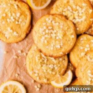 Delicious lemon white chocolate cookies, garnished with mini white chocolate chips and lemon zest sugar, ready to be enjoyed.