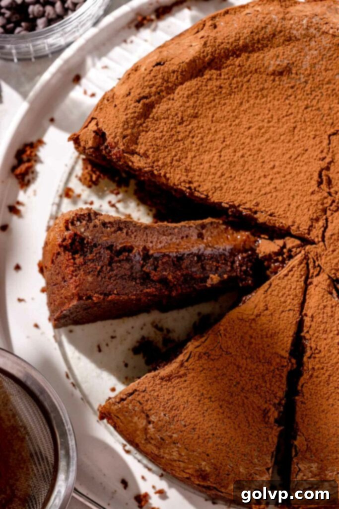 Sliced gooey butter cake, revealing the rich chocolate base and creamy, gooey filling.