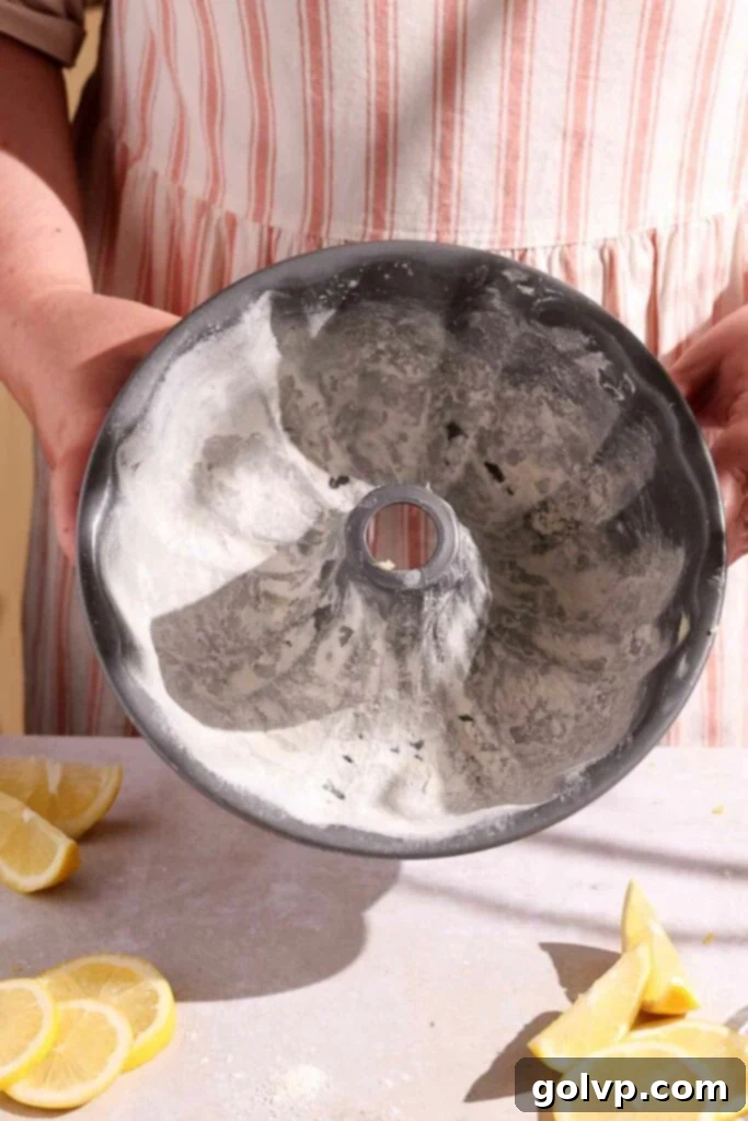 Sunshine Lemon Bundt 4 Preparing a bundt pan by greasing and flouring it