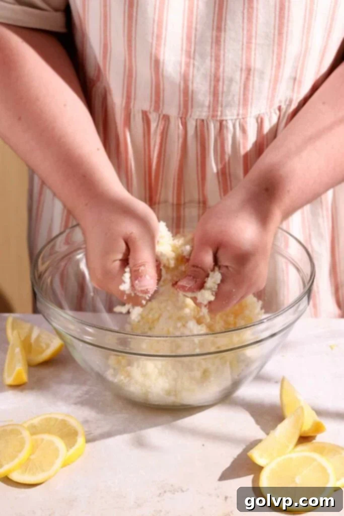 Sunshine Lemon Bundt 5 Rubbing lemon zest into sugar for maximum flavor