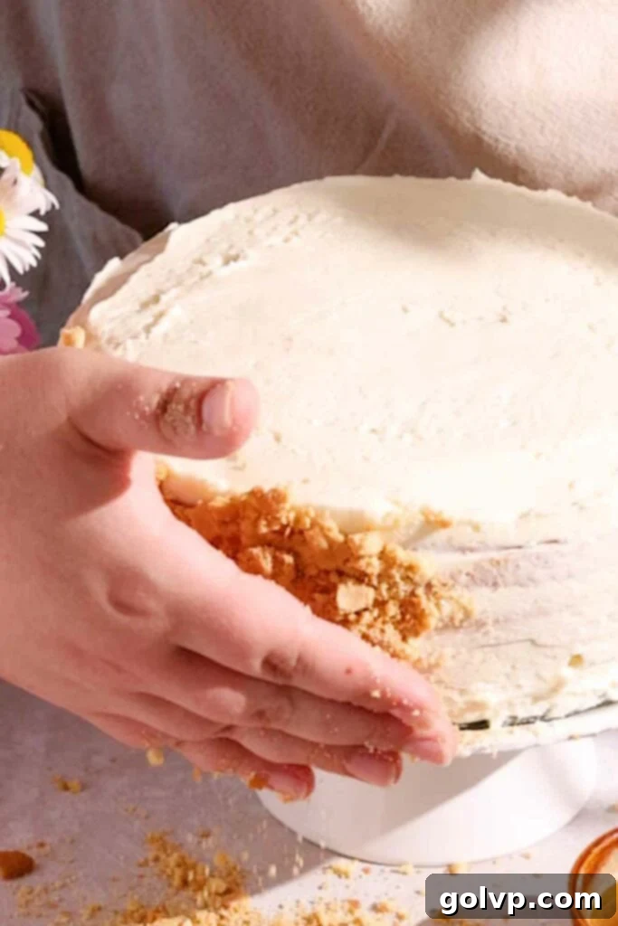 Medovik Honey Cake 13 pressing crumbs onto sides