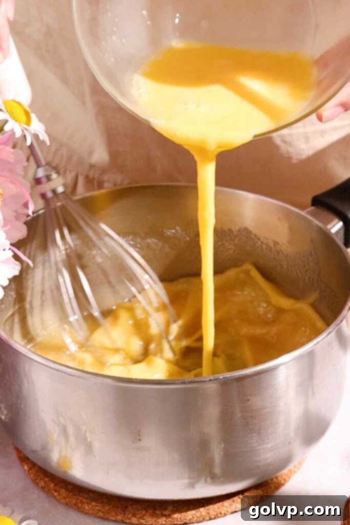 Medovik Honey Cake 5 whisking eggs into hot honey mixture