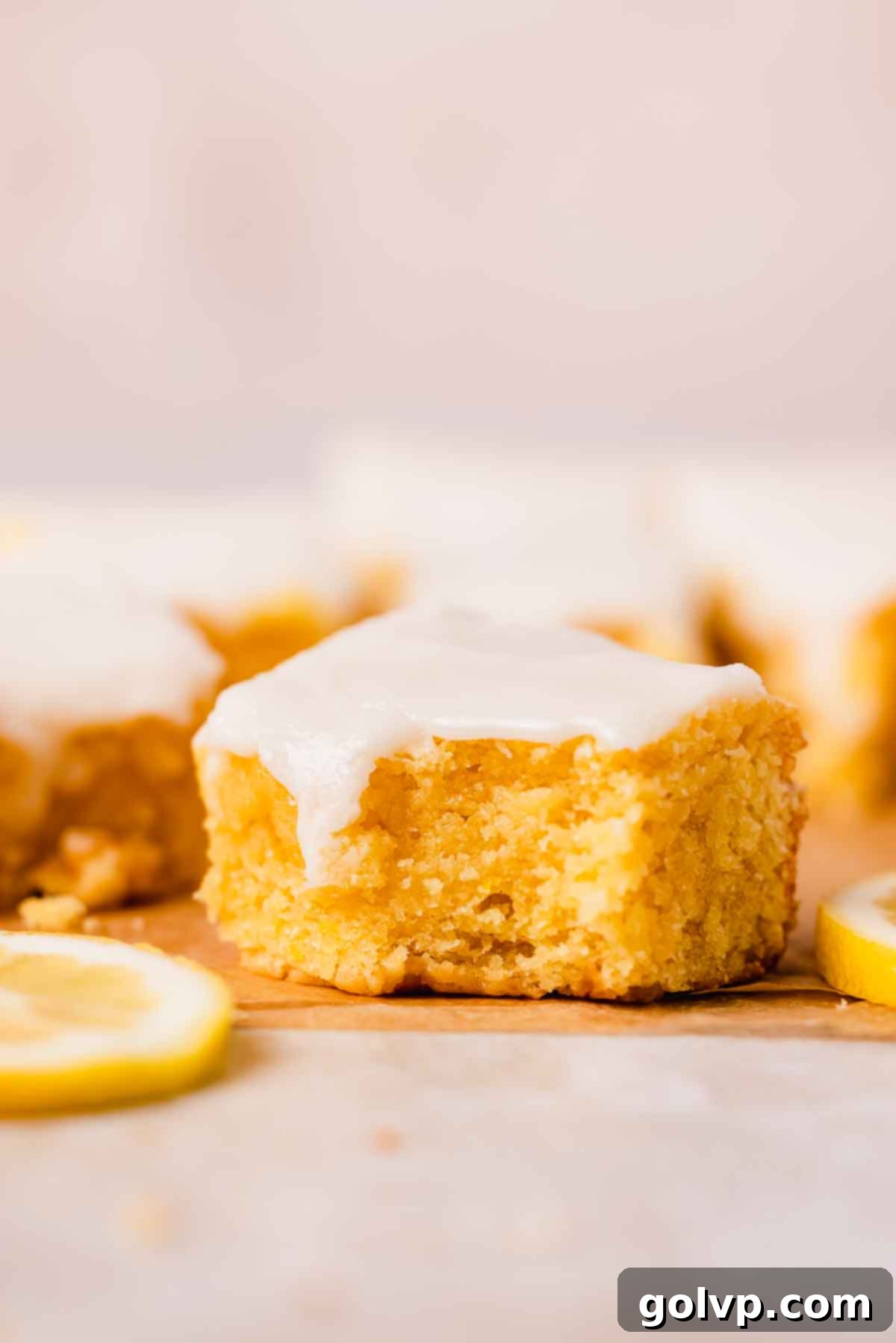 bitten lemon brownie close up to show fudgy texture