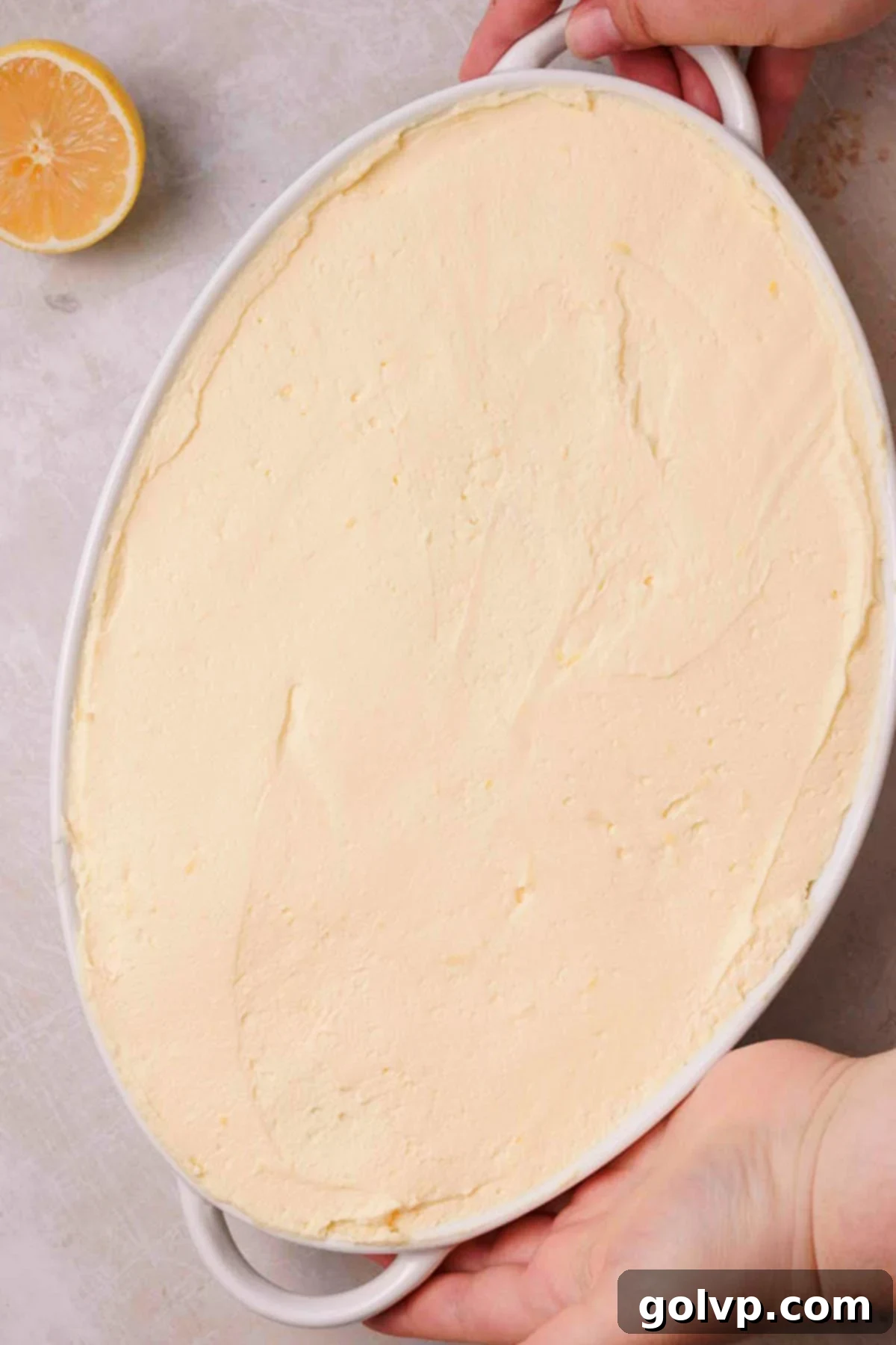 lemon curd tiramisu in ceramic tray with smoothed top