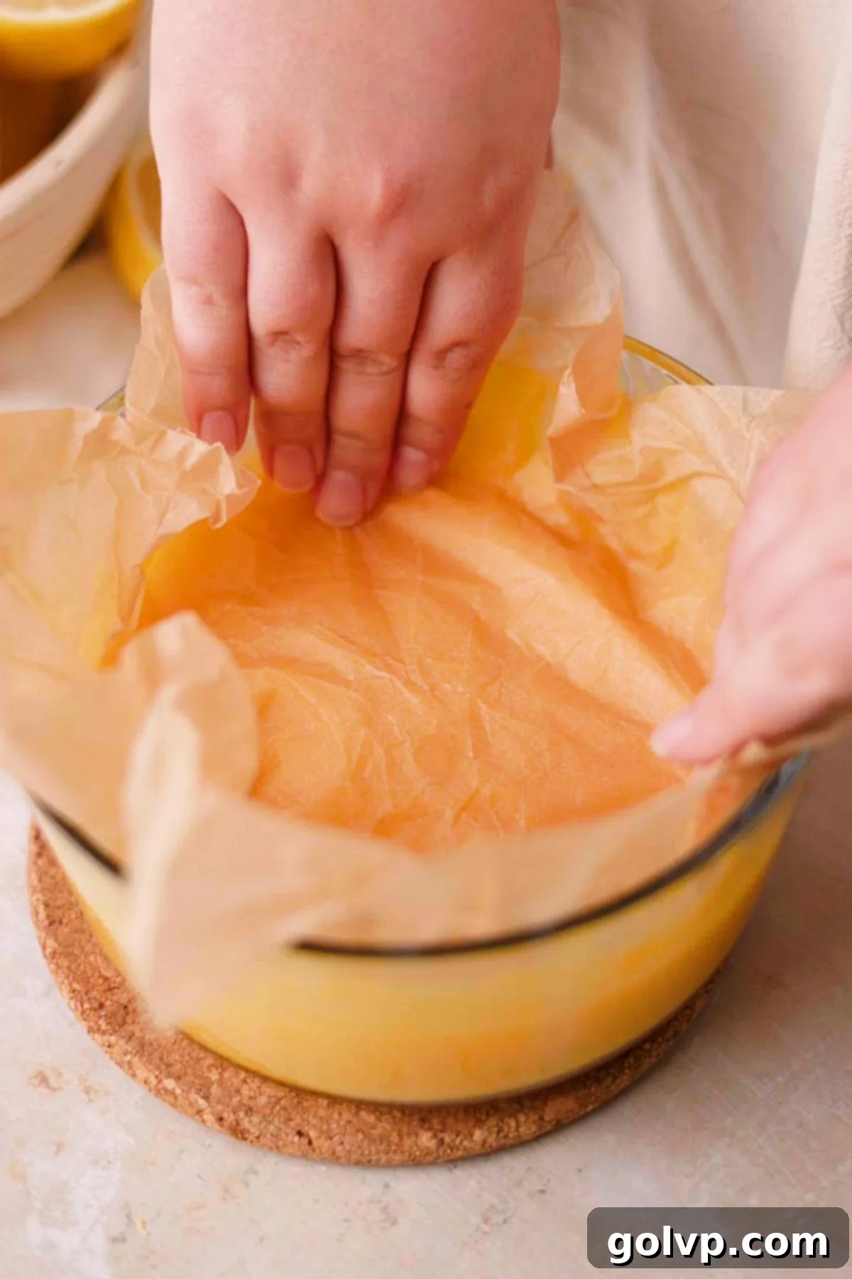 cover surface of lemon curd with parchment paper