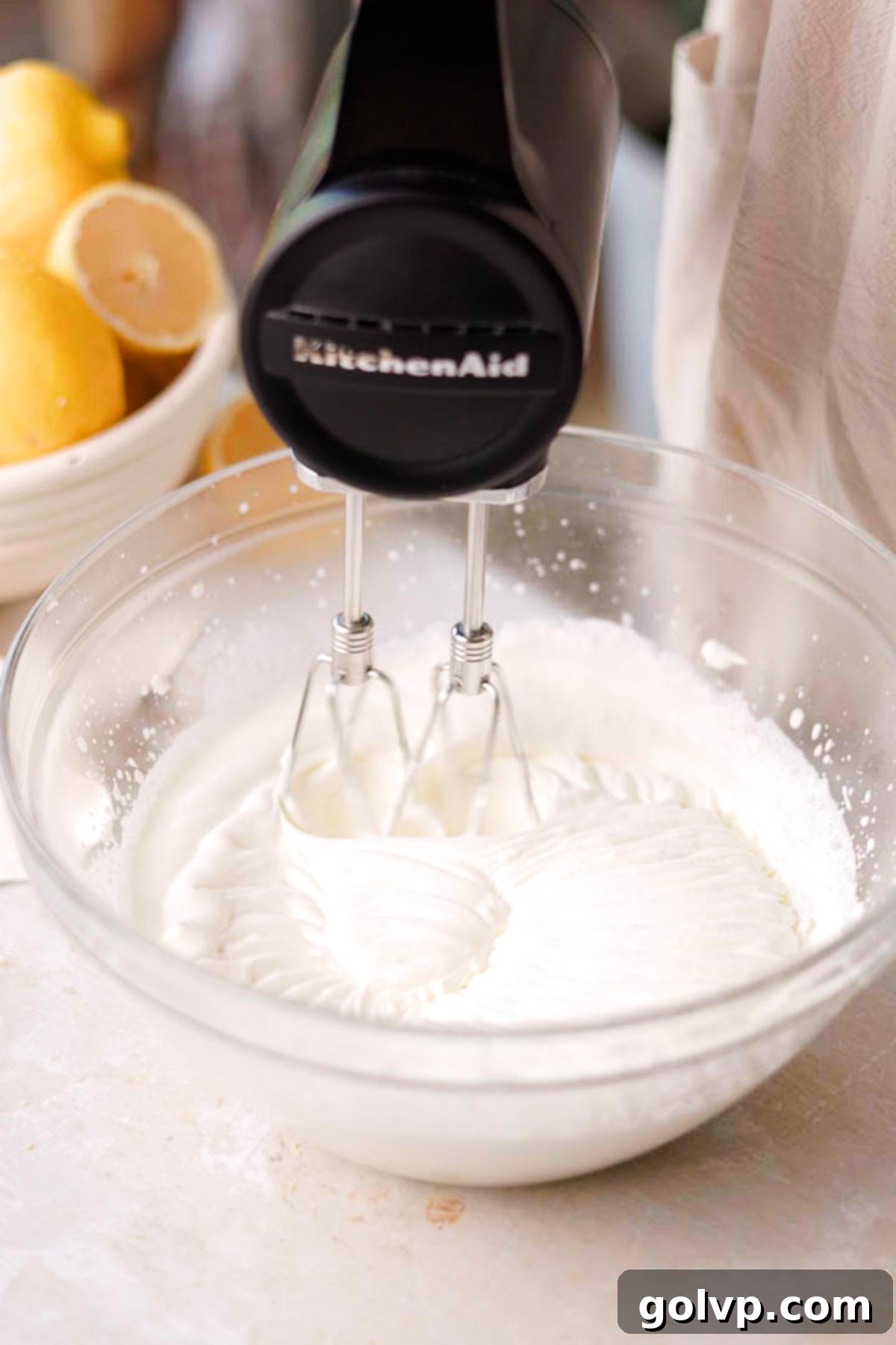 whip cream in large chilled glass bowl