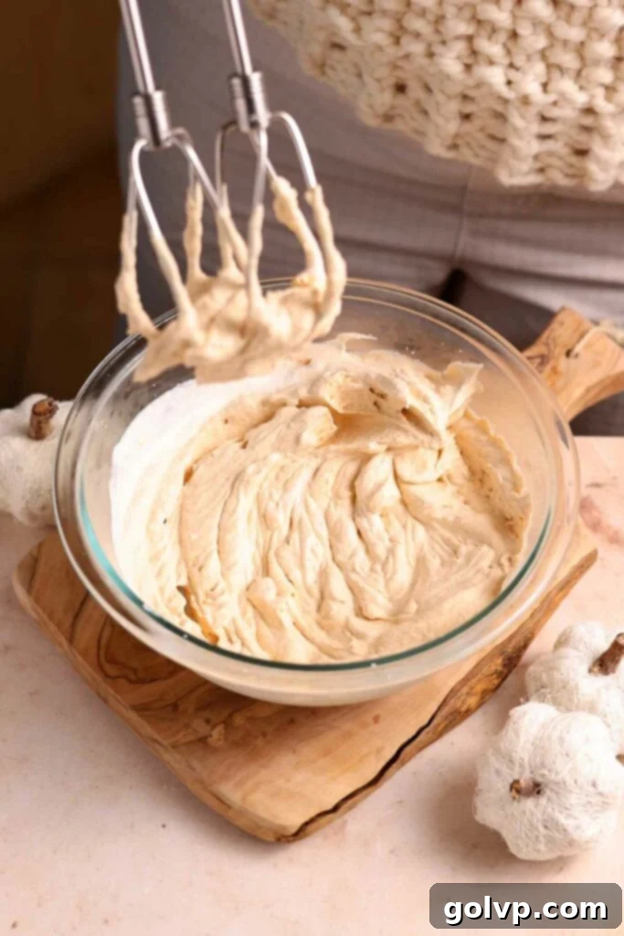 whip cream to stiff peaks with pumpkin puree added