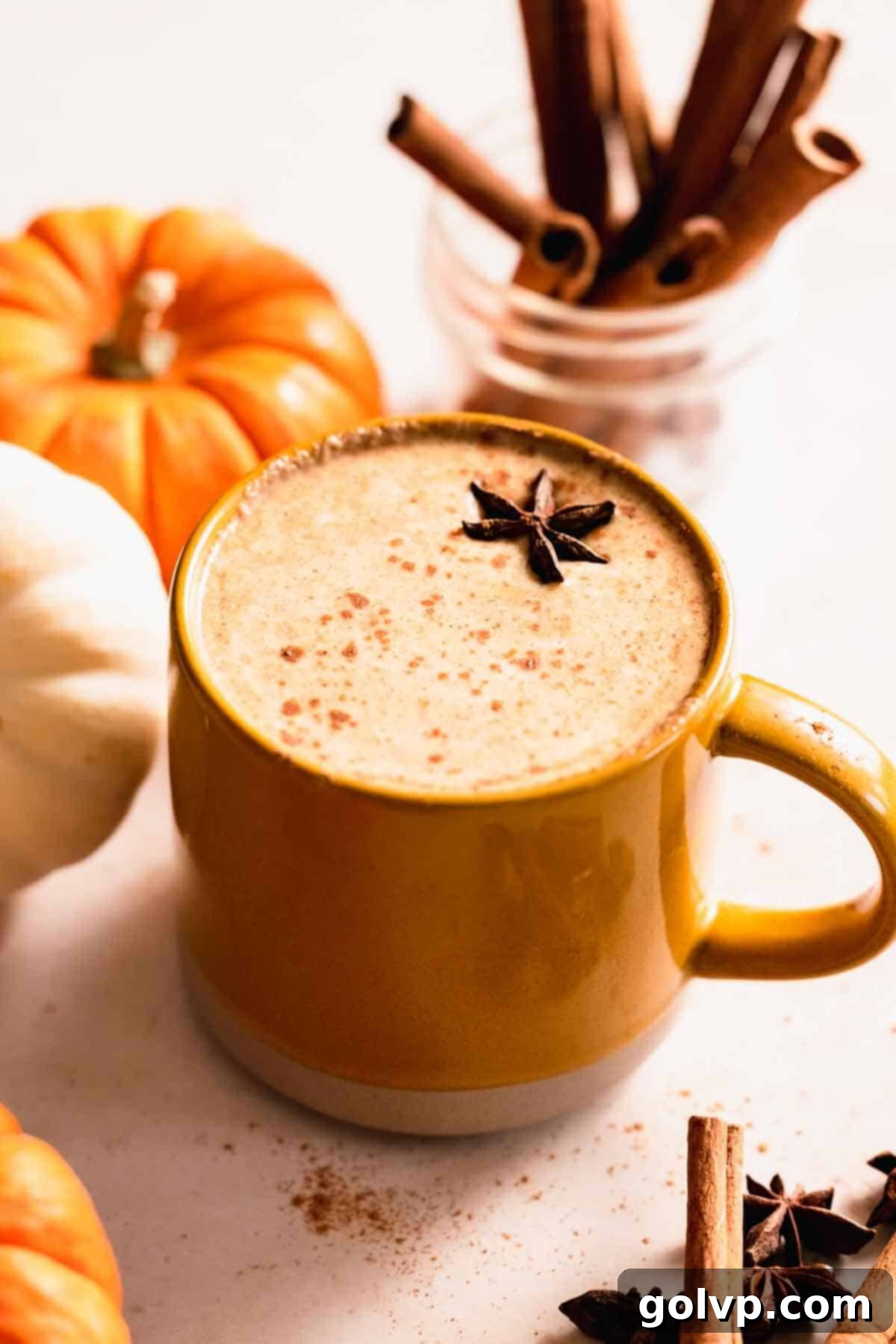 Cozy pumpkin chai latte in a mug, garnished with star anise, perfect for fall