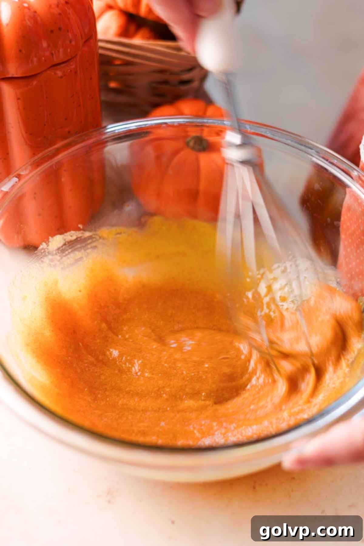 whisking yolks and sugar until combined in large glass bowl