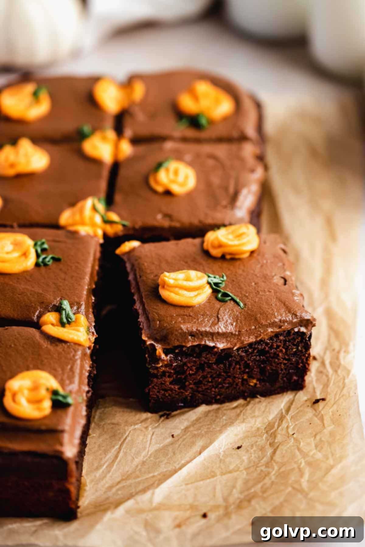 Chocolate cake with frosting and mini pumpkins