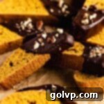 pumpkin biscotti covered in chocolate and chopped pecans