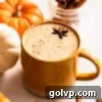 pumpkin spice latte in mug with cinnamon sticks and star anise