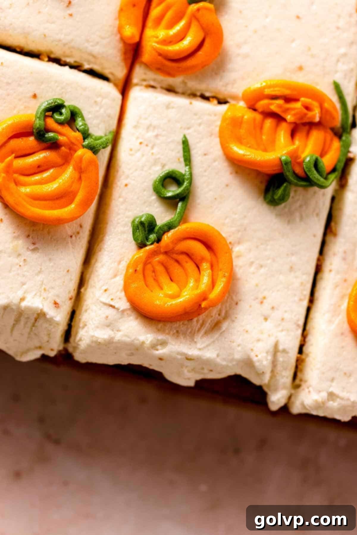 frosting with piped mini pumpkins on top