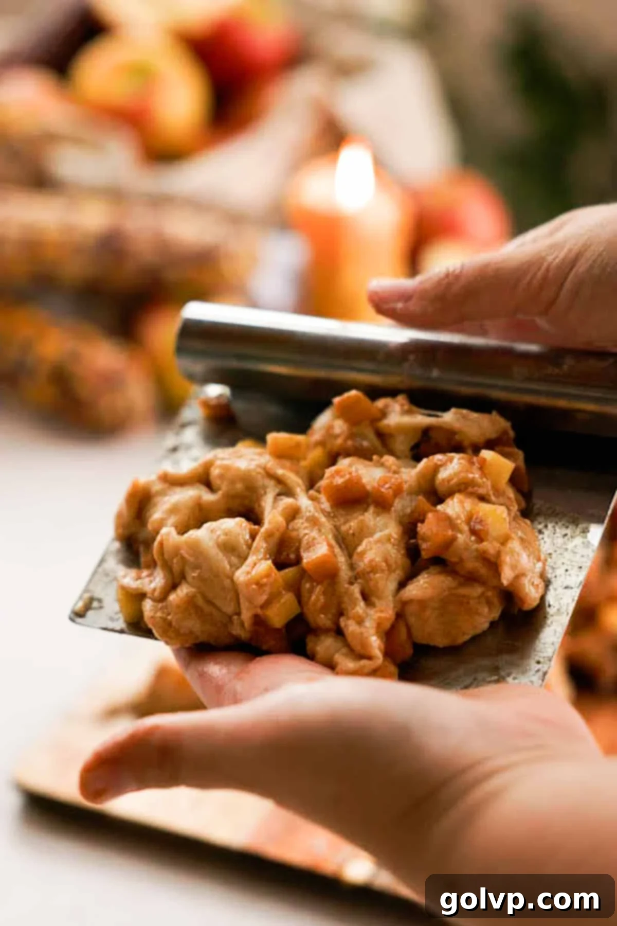 shaping apple fritters on a bench scraper