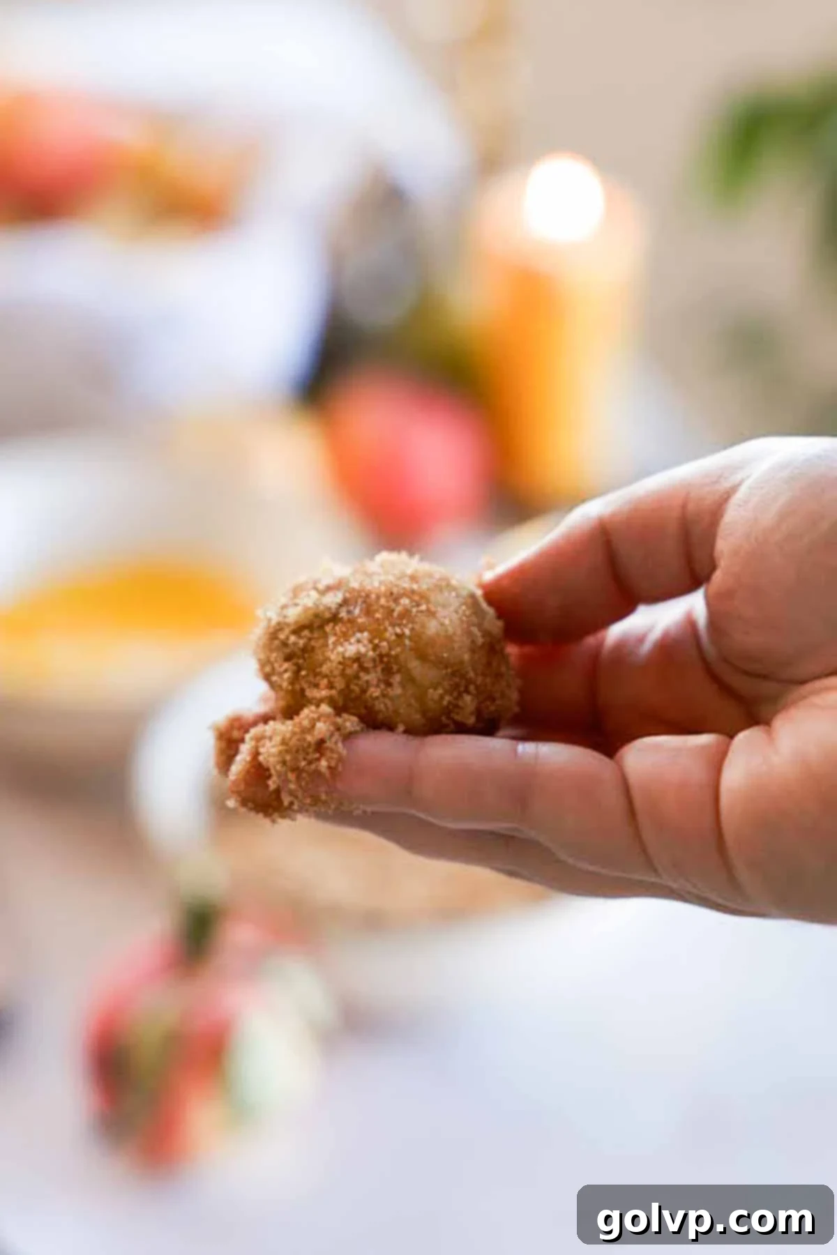 monkey bread dough ball rolled in cinnamon sugar