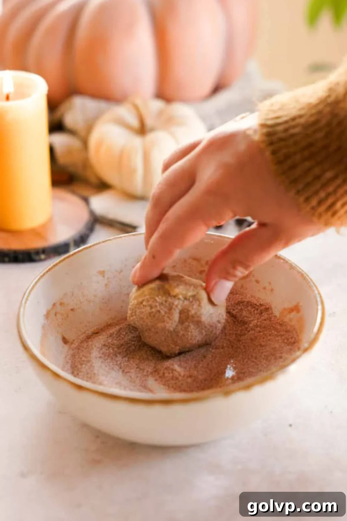 rolling chai cookie dough in spiced sugar