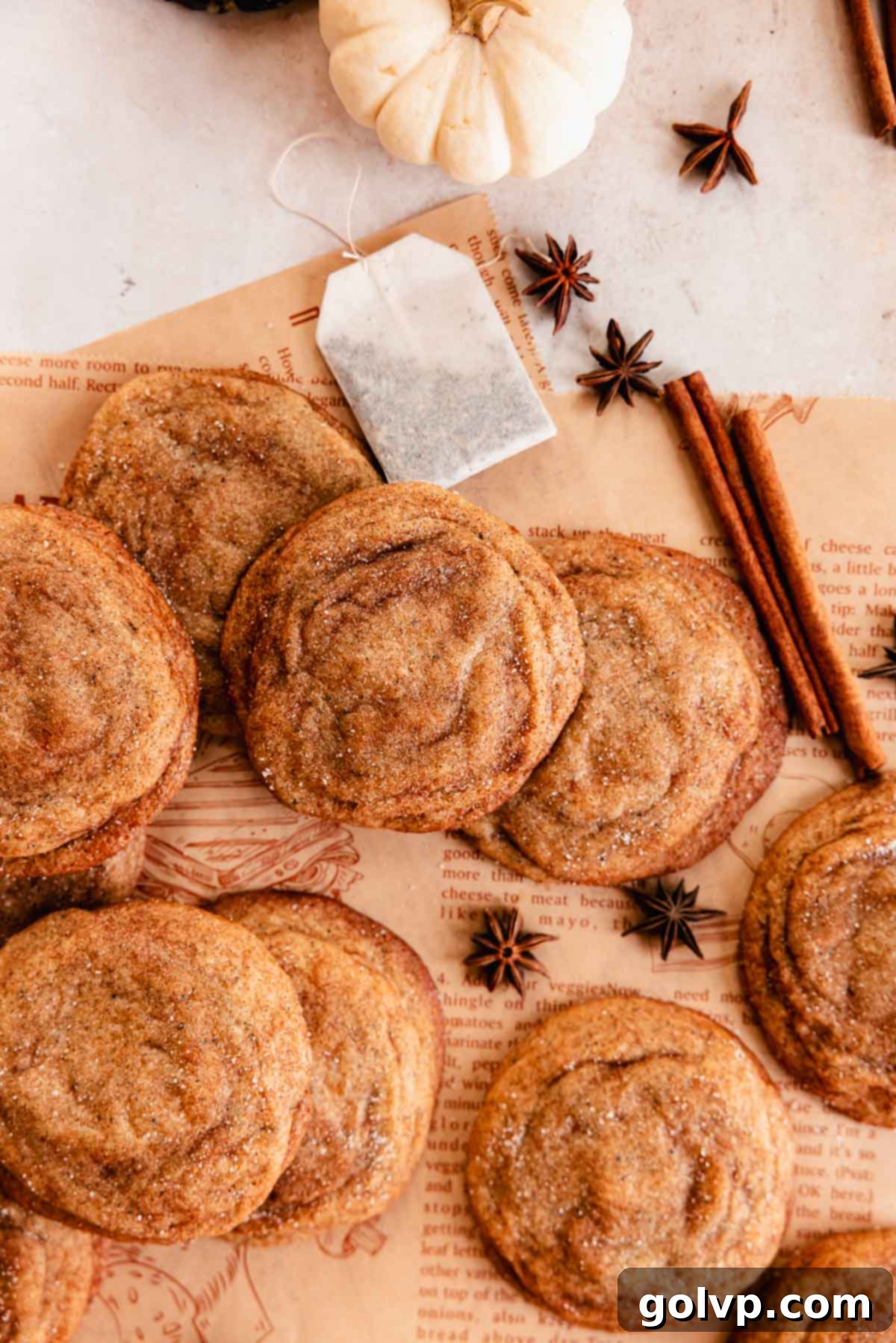 chai cookies on parchment paper with cinnamon and anise seeds