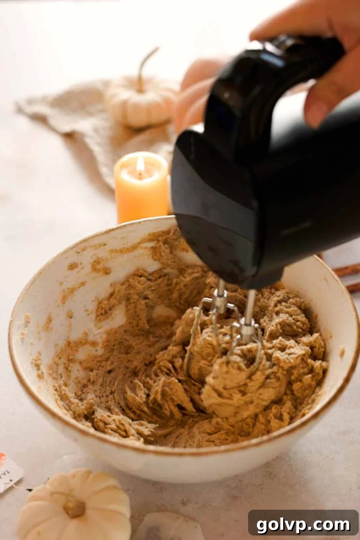 mixing together chai cookie dough wet ingredients with electric mixer