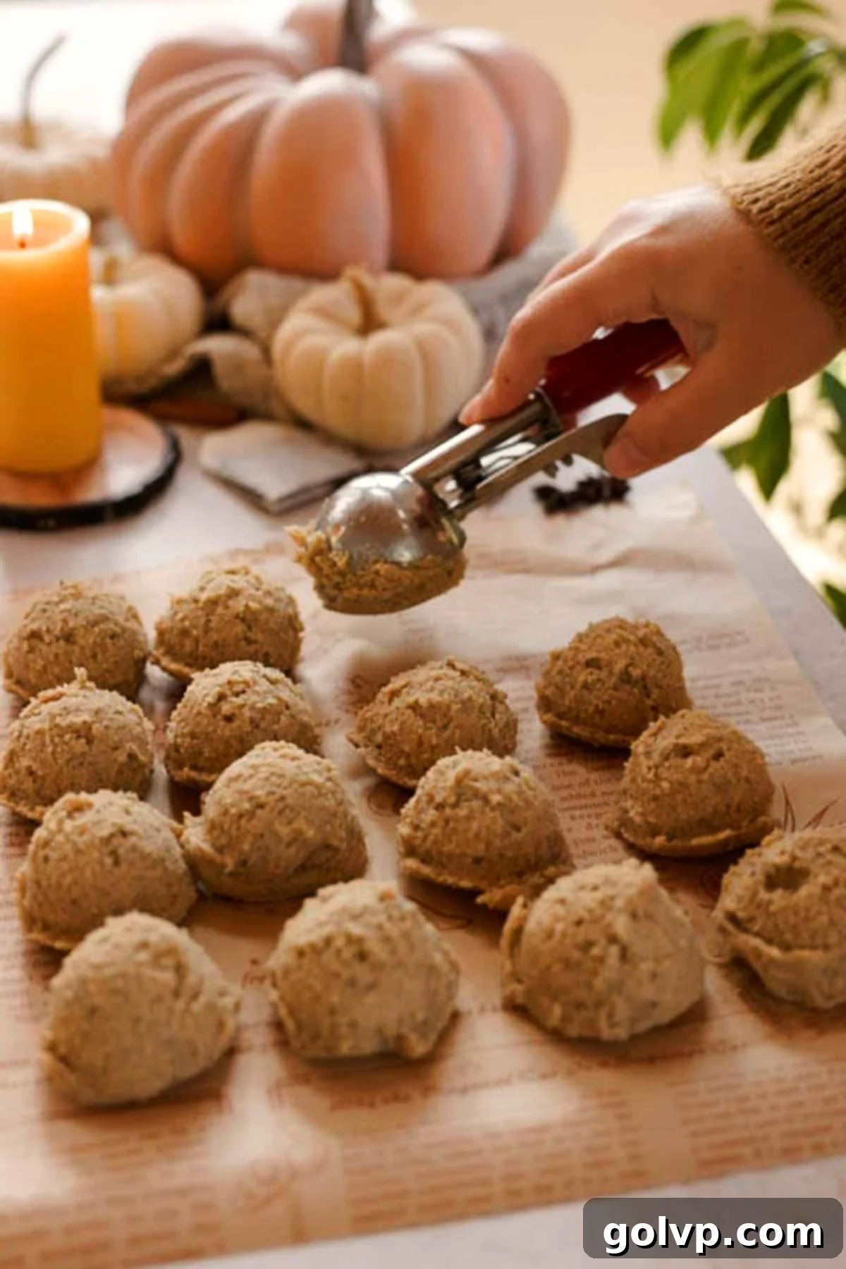 scooping chai cookie dough onto parchment paper